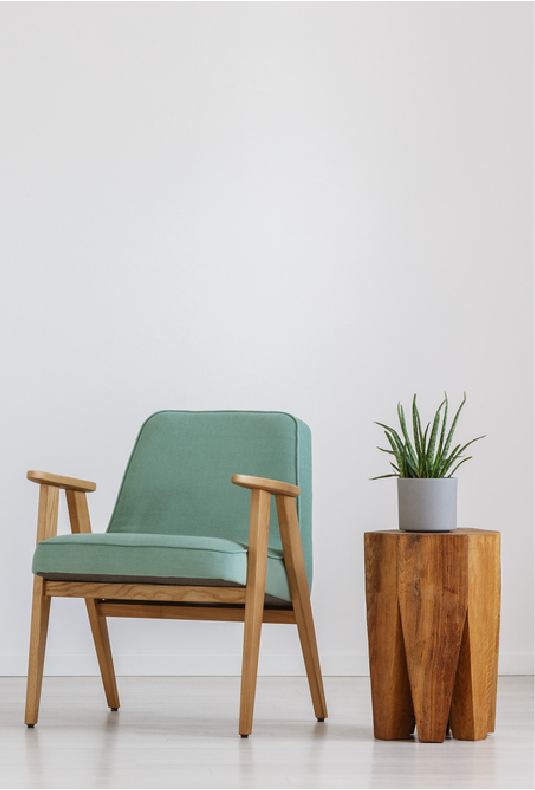Luxury Living Design — teal armchair and wooden plant stand